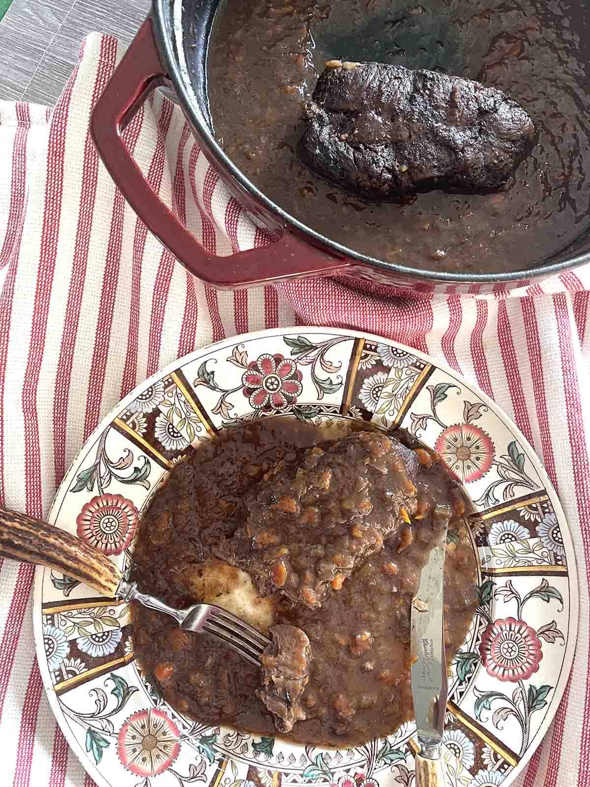 featherblade steak and gravy on a plate.