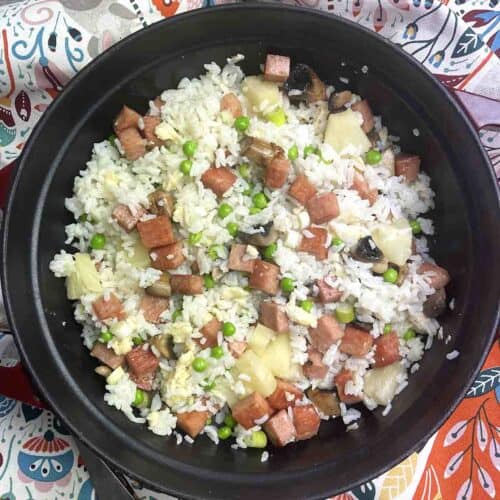 spam and pineapple fried rice in a dish.