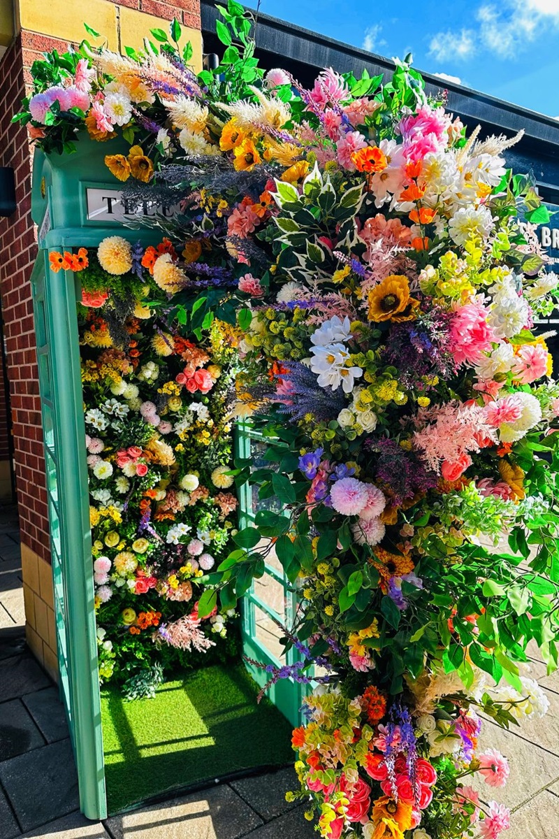 A Telephone Box Full Of Flowers
