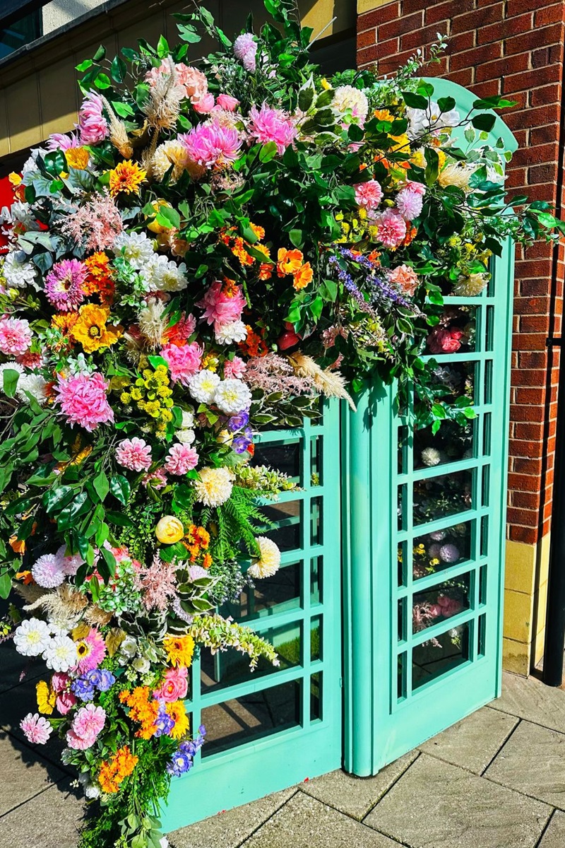A Telephone Box Full Of Flowers