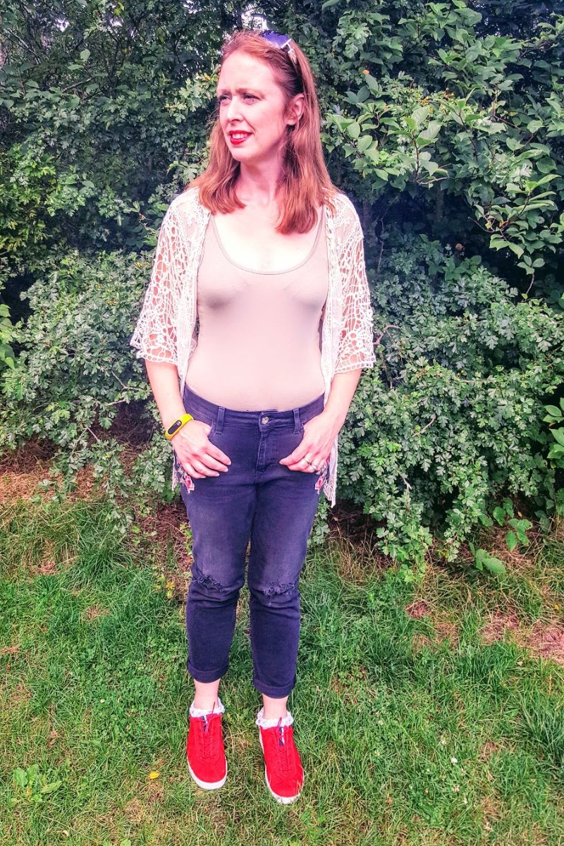 Faded Ripped Jeans With Roses On And Holes In Knee