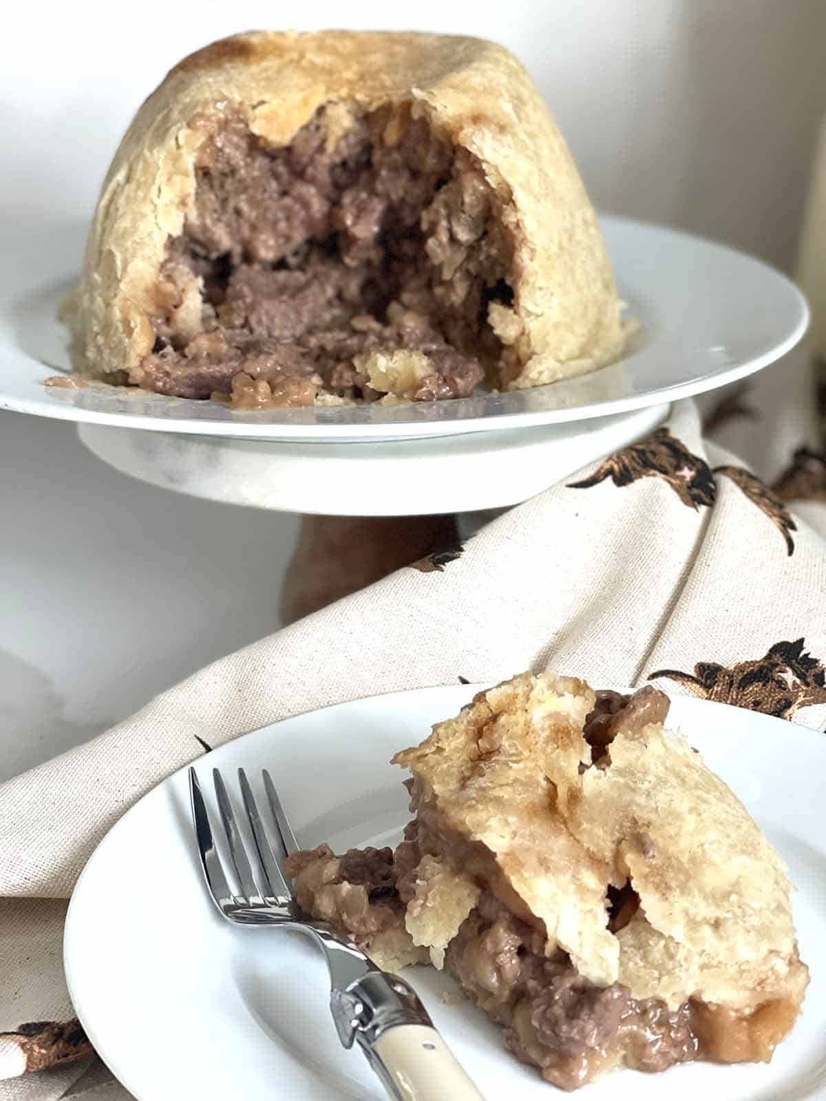 pie with a slice on a plate.