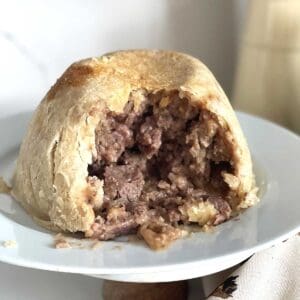 steak and kidney pudding with portion taken.