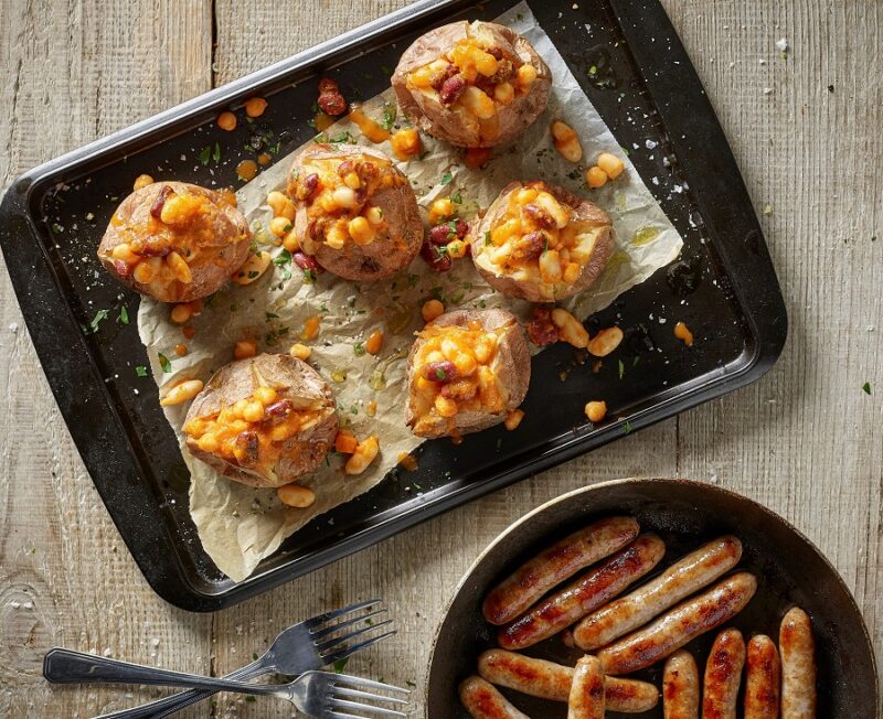 9 Irresistible Jacket Potato Fillings That Beat The Boring Toppings Any Day Of The Week Spicy Beans & Bangers on Baked Potatoes The Ultimate Comfort Food Recipe
