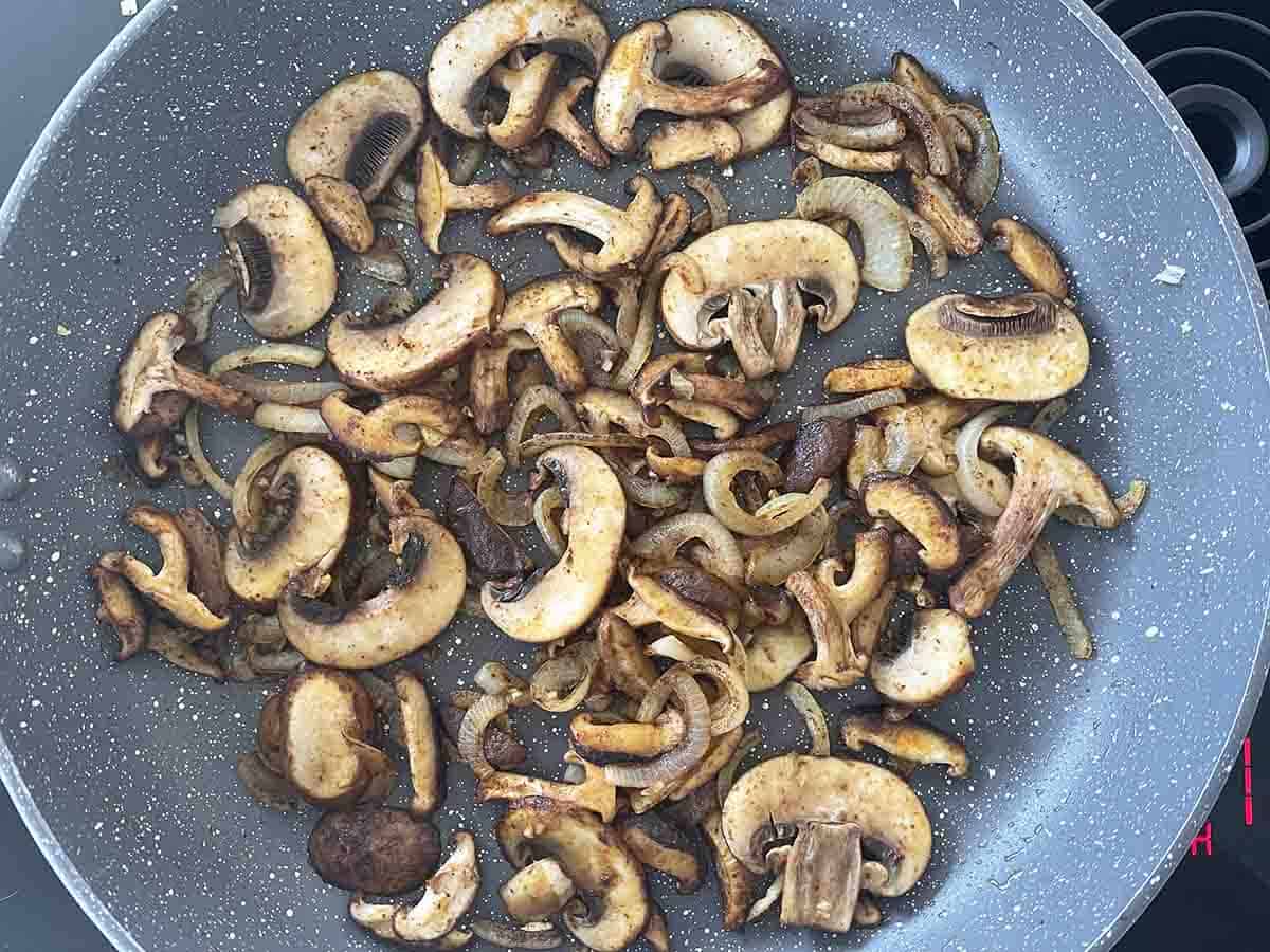 mushrooms added to onions.